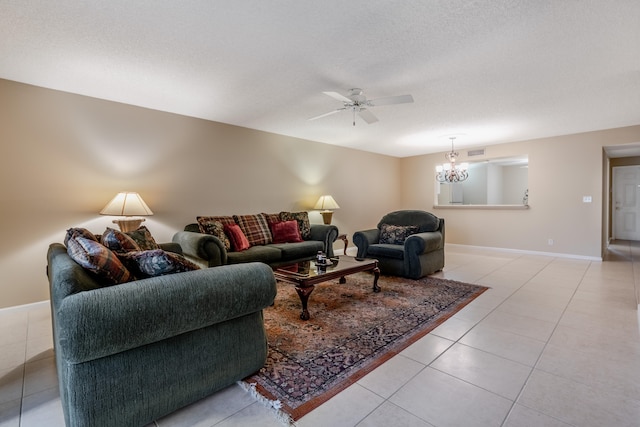 9717 Sills Dr E Unit 103, Boynton Beach, FL 33437 - living room with a chandelier, a ceiling fan, light tile patterned flooring, baseboards, and a textured ceiling
