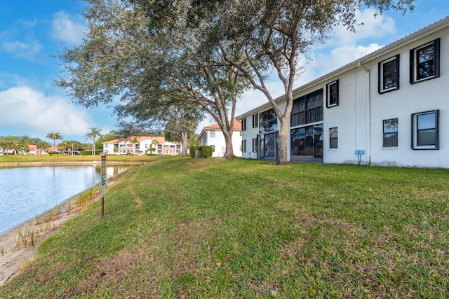 9717 Sills Dr E Unit 103, Boynton Beach, FL 33437 - view of green lawn featuring a water view