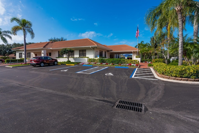 9717 Sills Dr E Unit 103, Boynton Beach, FL 33437 - view of property featuring uncovered parking