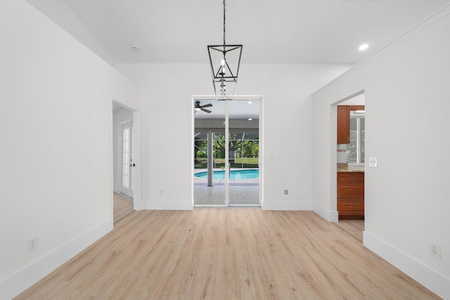 2707 SE Rawlings Rd, Port Saint Lucie, FL 34952 - unfurnished dining area featuring light wood-style floors, ceiling fan, baseboards, and recessed lighting