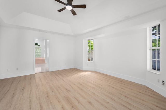 2707 SE Rawlings Rd, Port Saint Lucie, FL 34952 - spare room with healthy amount of natural light, ceiling fan, wood finished floors, and baseboards