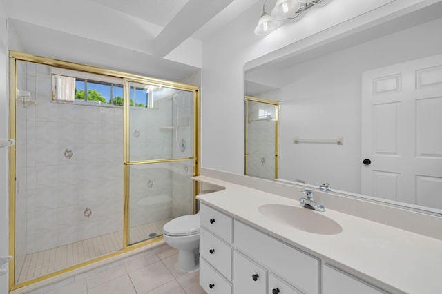 2707 SE Rawlings Rd, Port Saint Lucie, FL 34952 - bathroom featuring toilet, a stall shower, vanity, and tile patterned floors