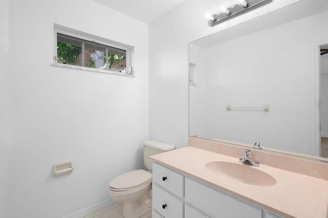 2707 SE Rawlings Rd, Port Saint Lucie, FL 34952 - bathroom with vanity, toilet, and tile patterned flooring
