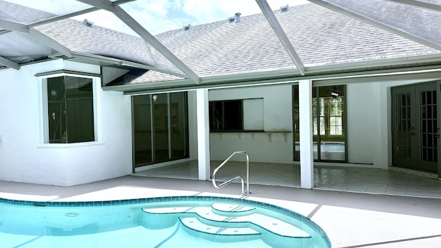 2707 SE Rawlings Rd, Port Saint Lucie, FL 34952 - swimming pool featuring french doors, a patio, and a lanai