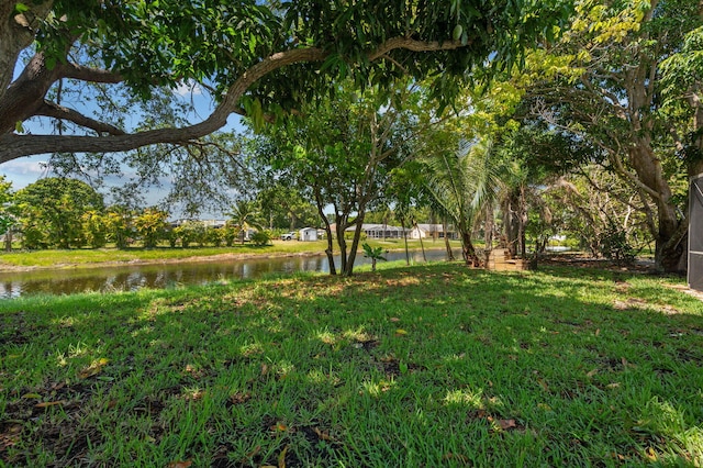 2707 SE Rawlings Rd, Port Saint Lucie, FL 34952 - view of yard with a water view