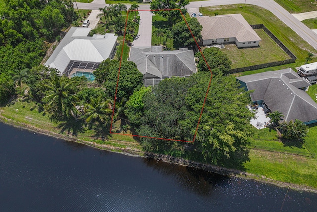 2707 SE Rawlings Rd, Port Saint Lucie, FL 34952 - aerial view of property and surrounding area with property parcel outlined and a large body of water