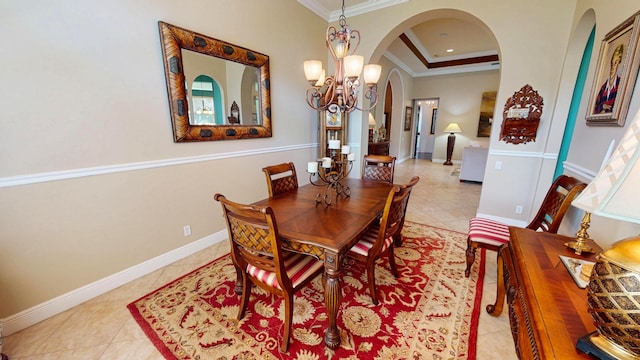 11206 SW Apple Blossom Trl, Port Saint Lucie, FL 34987 - dining space featuring arched walkways, ornamental molding, a chandelier, light tile patterned floors, and baseboards