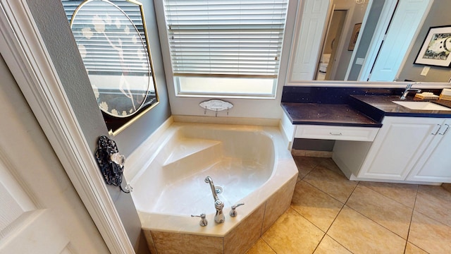 11206 SW Apple Blossom Trl, Port Saint Lucie, FL 34987 - full bath with a garden tub, vanity, and tile patterned floors
