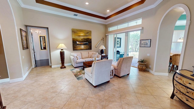 11206 SW Apple Blossom Trl, Port Saint Lucie, FL 34987 - living area featuring ornamental molding, a tray ceiling, light tile patterned floors, arched walkways, and a chandelier