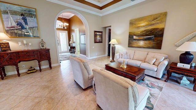 11206 SW Apple Blossom Trl, Port Saint Lucie, FL 34987 - living room featuring arched walkways, crown molding, light tile patterned flooring, and baseboards