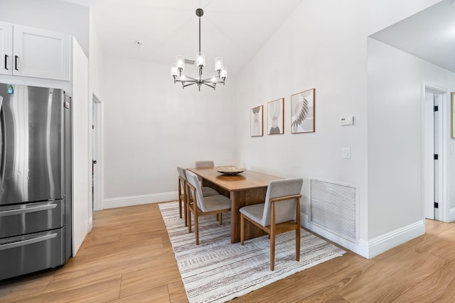 2540 NW 80th Ave, Margate, FL 33063 - dining room with a chandelier, baseboards, and light wood-type flooring
