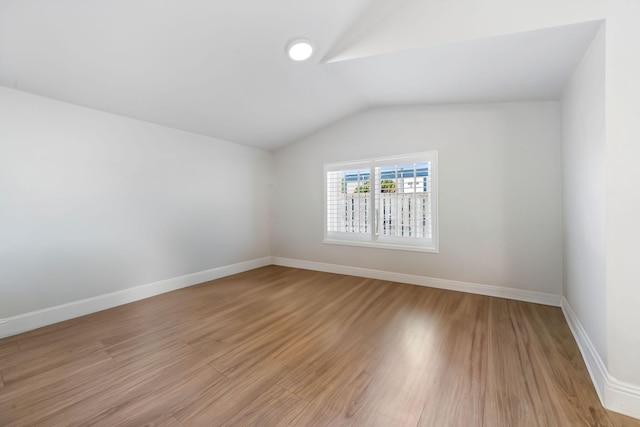 2540 NW 80th Ave, Margate, FL 33063 - additional living space featuring lofted ceiling, light wood finished floors, and baseboards