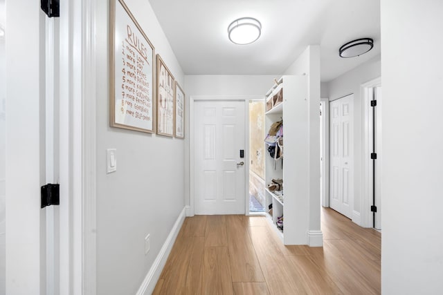 2540 NW 80th Ave, Margate, FL 33063 - corridor with light wood-type flooring and baseboards