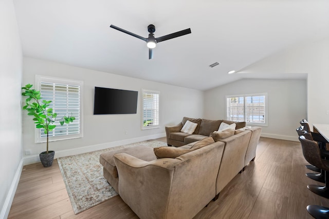 2540 NW 80th Ave, Margate, FL 33063 - living room with healthy amount of natural light, ceiling fan, lofted ceiling, wood finished floors, and baseboards