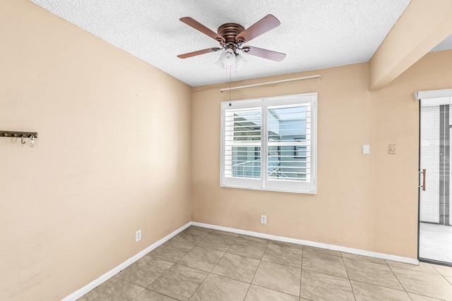 35 Capri A Unit A, Delray Beach, FL 33484 - unfurnished room featuring a textured ceiling, a ceiling fan, baseboards, and light tile patterned flooring