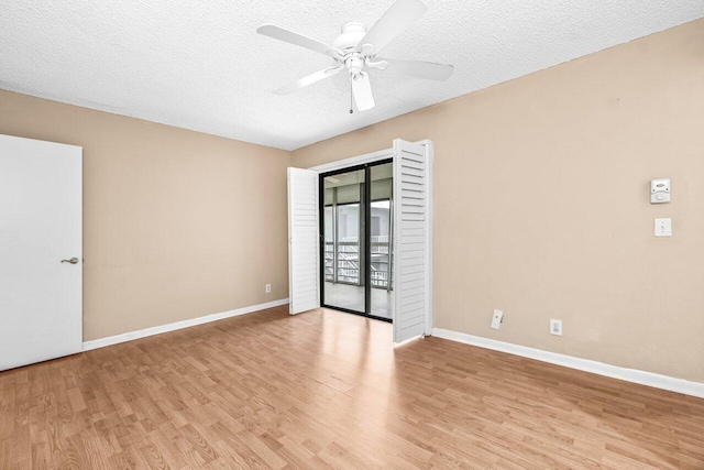 35 Capri A Unit A, Delray Beach, FL 33484 - empty room with light wood-style flooring, a ceiling fan, a textured ceiling, and baseboards
