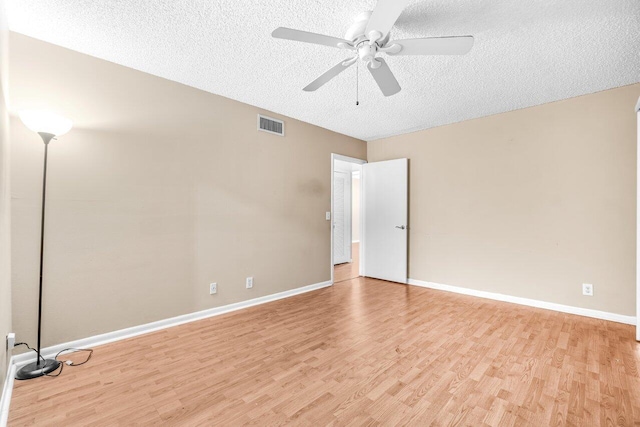 35 Capri A Unit A, Delray Beach, FL 33484 - empty room featuring a textured ceiling, light wood-style floors, ceiling fan, and baseboards