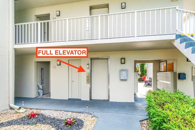 35 Capri A Unit A, Delray Beach, FL 33484 - entrance to property featuring stucco siding and elevator