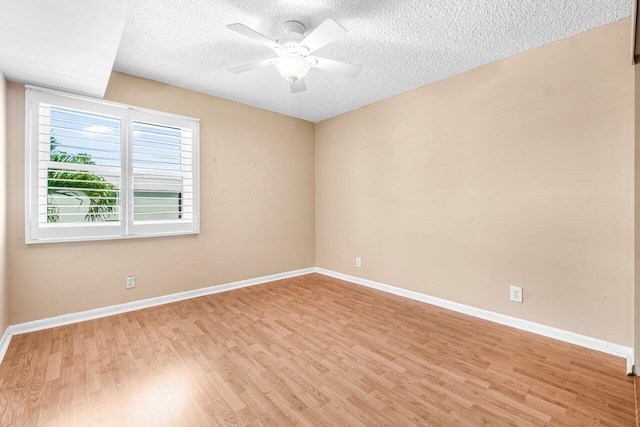 35 Capri A Unit A, Delray Beach, FL 33484 - empty room with light wood-style flooring, ceiling fan, a textured ceiling, and baseboards