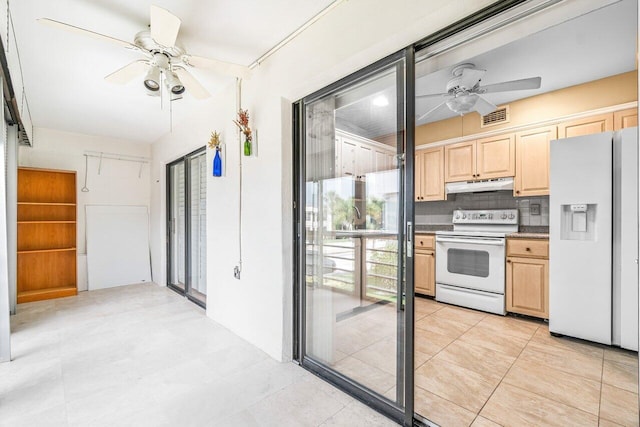 35 Capri A Unit A, Delray Beach, FL 33484 - kitchen featuring white appliances, under cabinet range hood, ceiling fan, and light brown cabinetry