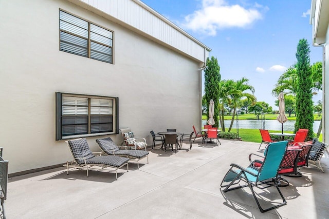 35 Capri A Unit A, Delray Beach, FL 33484 - view of patio / terrace featuring a water view and outdoor dining space