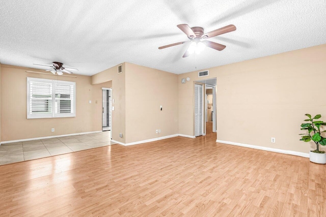 35 Capri A Unit A, Delray Beach, FL 33484 - unfurnished room with a ceiling fan, a textured ceiling, light wood-type flooring, and baseboards