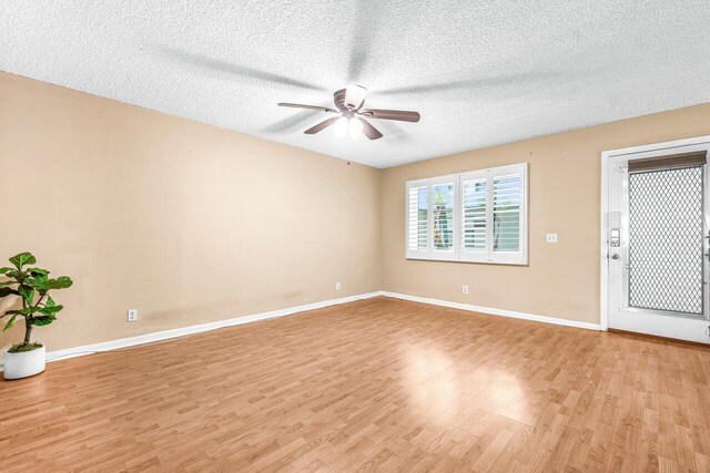 35 Capri A Unit A, Delray Beach, FL 33484 - spare room with light wood-style flooring, ceiling fan, baseboards, and a textured ceiling