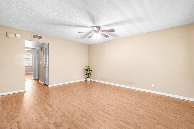 35 Capri A Unit A, Delray Beach, FL 33484 - unfurnished room featuring a ceiling fan, light wood-style floors, a textured ceiling, baseboards, and a smoke detector