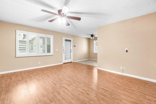 35 Capri A Unit A, Delray Beach, FL 33484 - unfurnished room with ceiling fan, a textured ceiling, light wood-type flooring, and baseboards