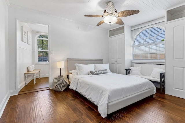 722 Valley Forge Rd, West Palm Beach, FL 33405 - bedroom featuring dark wood-style flooring, ornamental molding, a ceiling fan, and baseboards