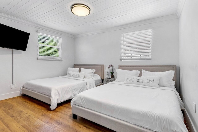 722 Valley Forge Rd, West Palm Beach, FL 33405 - bedroom with light wood-style flooring, ornamental molding, and baseboards