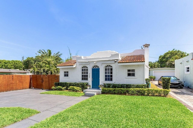 722 Valley Forge Rd, West Palm Beach, FL 33405 - mediterranean / spanish-style house featuring a tile roof, stucco siding, a chimney, and a gate