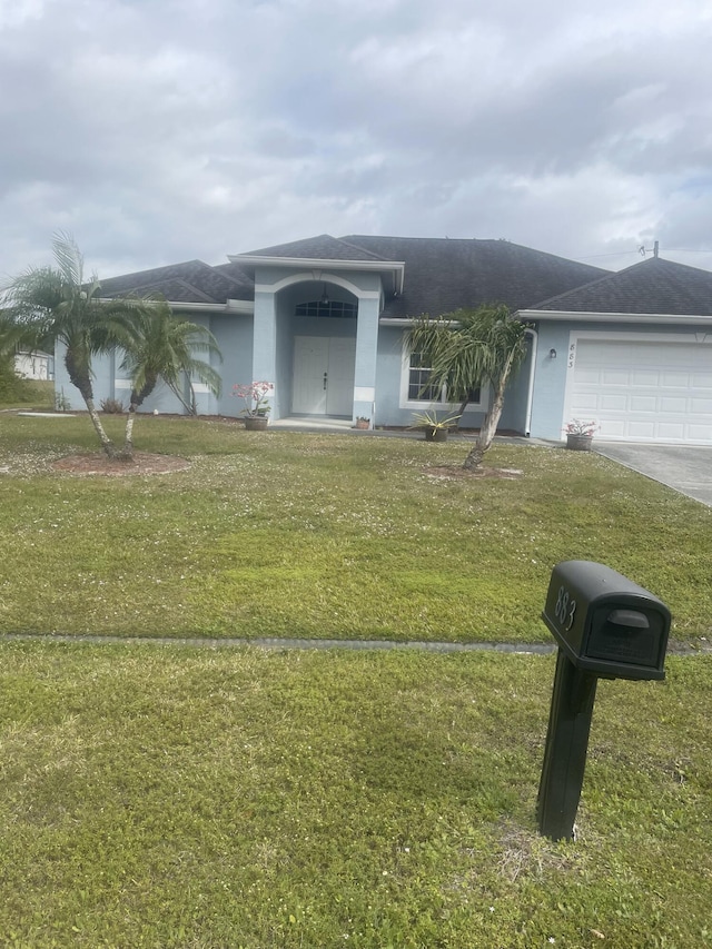 883 SW Mccall Rd, Port Saint Lucie, FL 34953 - ranch-style house with stucco siding, a garage, a front yard, and driveway