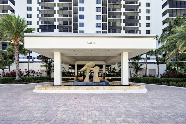 3400 S Ocean Blvd Unit 4H, Highland Beach, FL 33487 - view of apartment building / complex with a carport