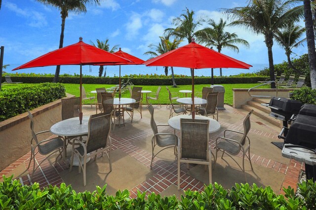 3400 S Ocean Blvd Unit 4H, Highland Beach, FL 33487 - view of patio / terrace featuring outdoor dining space