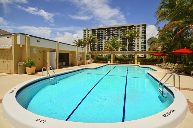 3400 S Ocean Blvd Unit 4H, Highland Beach, FL 33487 - community pool with a patio area