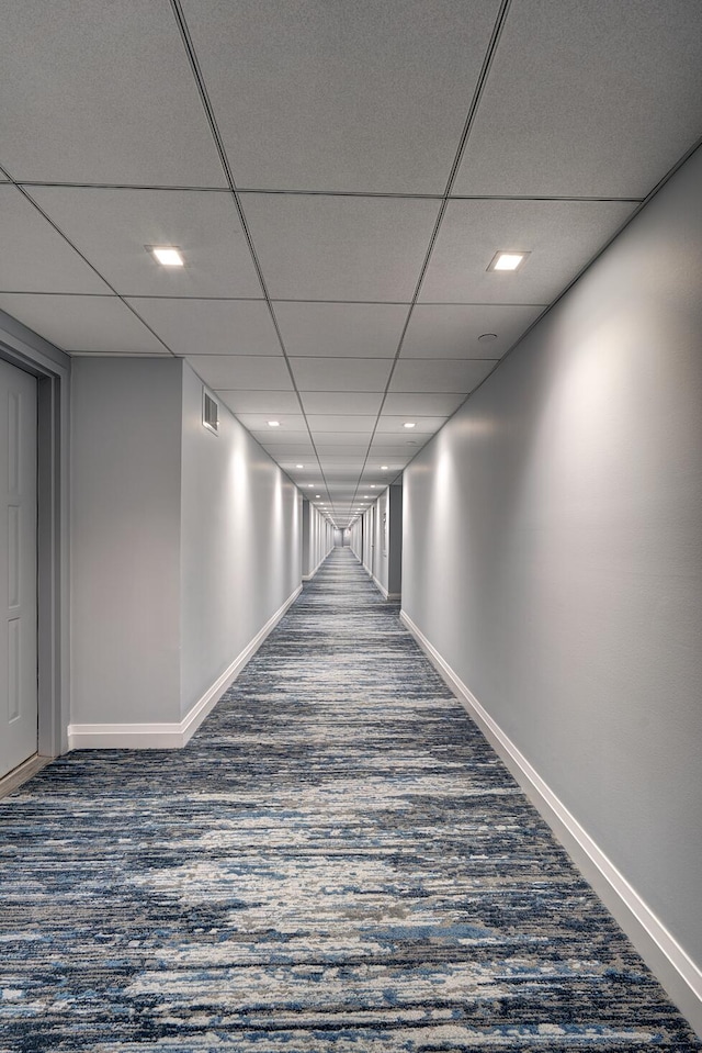3400 S Ocean Blvd Unit 4H, Highland Beach, FL 33487 - hallway featuring dark colored carpet, baseboards, and recessed lighting