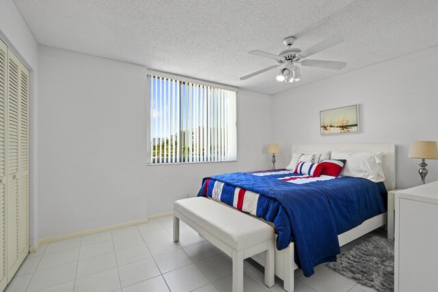 3400 S Ocean Blvd Unit 4H, Highland Beach, FL 33487 - bedroom with a textured ceiling, baseboards, and a ceiling fan
