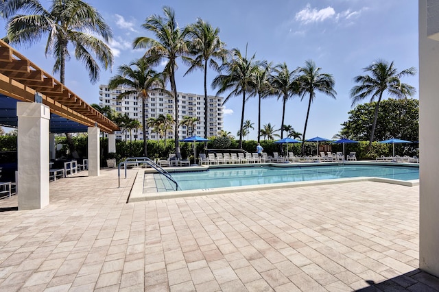 3400 S Ocean Blvd Unit 4H, Highland Beach, FL 33487 - community pool featuring a pergola and a patio
