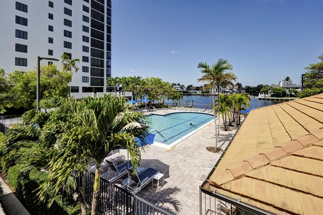 3400 S Ocean Blvd Unit 4H, Highland Beach, FL 33487 - community pool featuring a patio and a water view