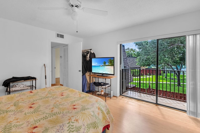 2883 SW 22nd Cir E Unit 51A, Delray Beach, FL 33445 - bedroom with access to exterior, wood finished floors, and ceiling fan