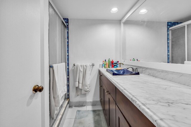 2883 SW 22nd Cir E Unit 51A, Delray Beach, FL 33445 - full bathroom with vanity, a shower stall, recessed lighting, tile patterned floors, and baseboards
