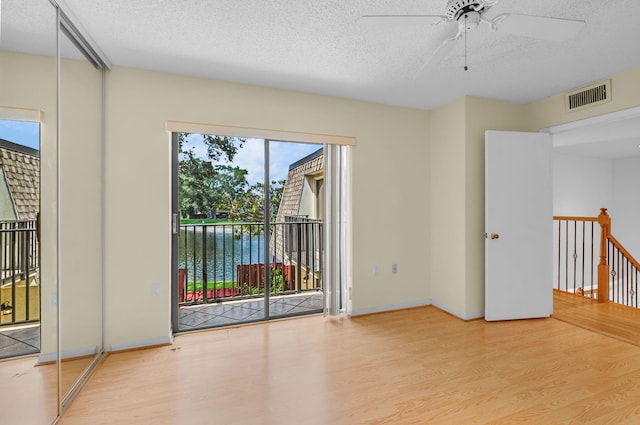 2883 SW 22nd Cir E Unit 51A, Delray Beach, FL 33445 - empty room featuring wood finished floors, a textured ceiling, ceiling fan, and baseboards
