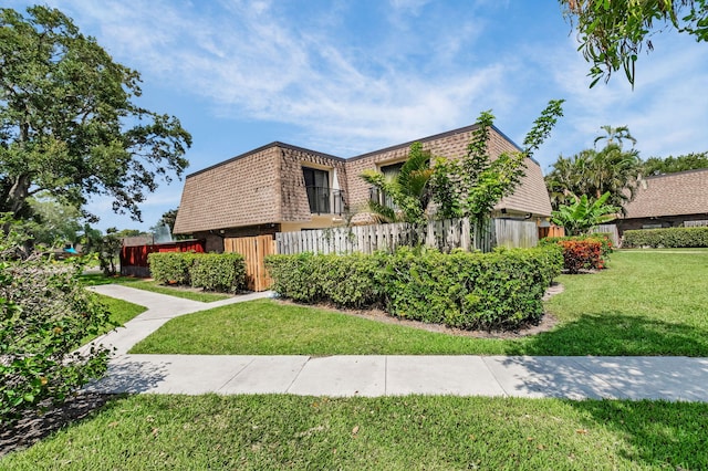 2883 SW 22nd Cir E Unit 51A, Delray Beach, FL 33445 - view of front facade featuring mansard roof and brick siding