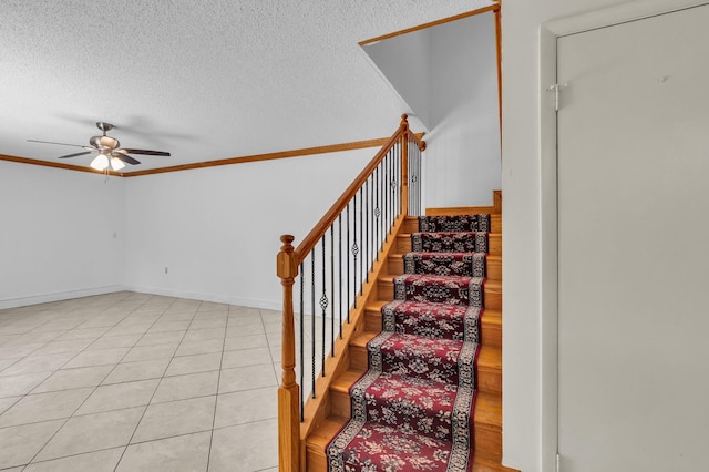 2883 SW 22nd Cir E Unit 51A, Delray Beach, FL 33445 - stairs featuring a ceiling fan, a textured ceiling, ornamental molding, and tile patterned flooring