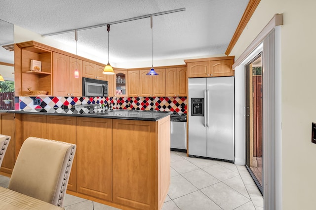 2883 SW 22nd Cir E Unit 51A, Delray Beach, FL 33445 - kitchen featuring stainless steel appliances, dark countertops, a peninsula, backsplash, and open shelves