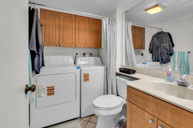2883 SW 22nd Cir E Unit 51A, Delray Beach, FL 33445 - bathroom with separate washer and dryer, tile patterned floors, toilet, vanity, and curtained shower
