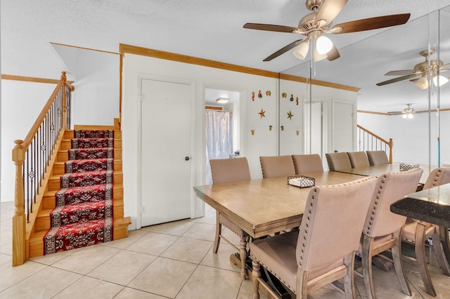 2883 SW 22nd Cir E Unit 51A, Delray Beach, FL 33445 - dining area with a ceiling fan, stairs, crown molding, and light tile patterned floors