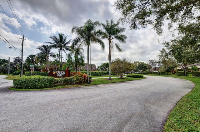 2883 SW 22nd Cir E Unit 51A, Delray Beach, FL 33445 - view of asphalt road featuring street lighting