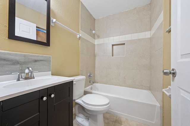 1332 SW G, Belle Glade, FL 33430 - bathroom featuring toilet, vanity, bathing tub / shower combination, tile patterned floors, and a textured wall